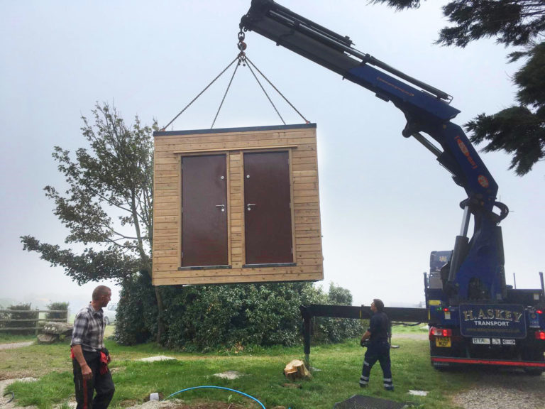 installation on a campsite of a portable toilet block