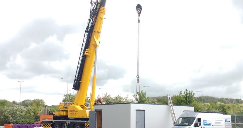Modular building being installed at a site