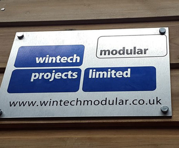 Our Wintech Modular logo on a timber clad building