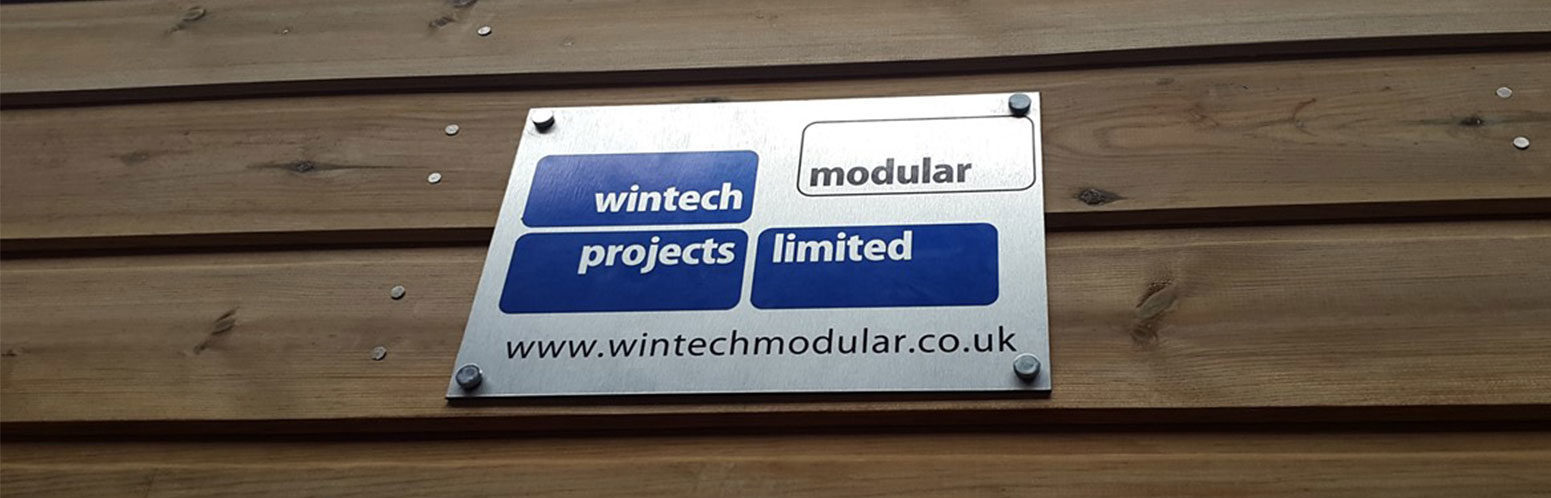 Our Wintech Modular logo on a timber clad building